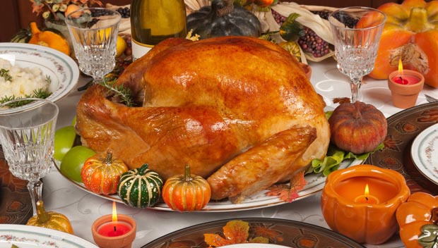 Thanksgiving meal table with turkey