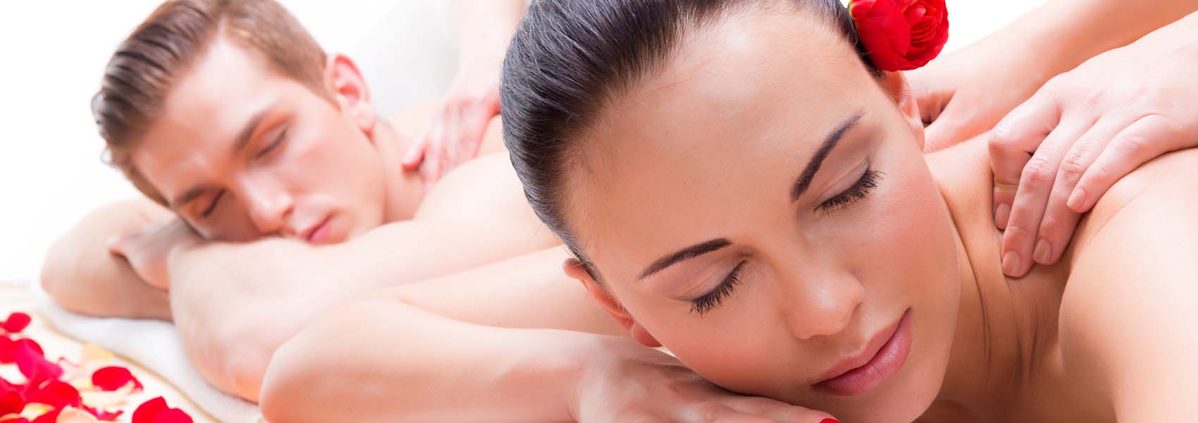Couple lying in a spa clinic enjoying back massage.
